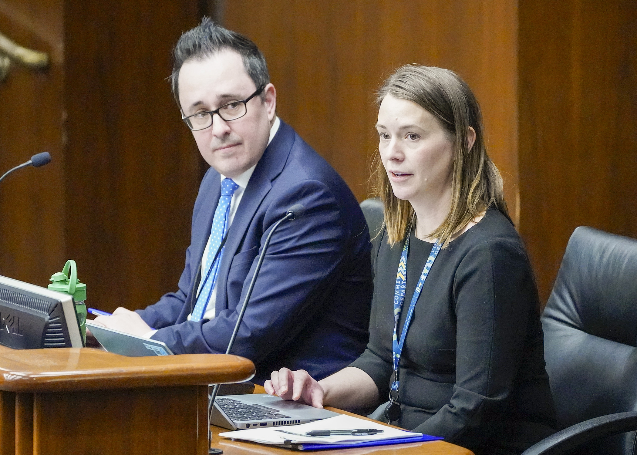 Peter Brickwedde, assistant commissioner of government and external affairs, and Julia Dreier, deputy commissioner for the Insurance Division, testify before the House Health Finance and Policy Committee Feb. 20. (Photo by Andrew VonBank)
